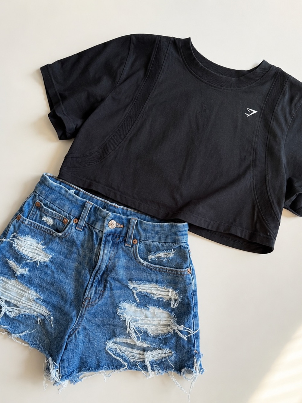 Gymshark Cropped Tee + American Eagle Distressed Denim Shorts